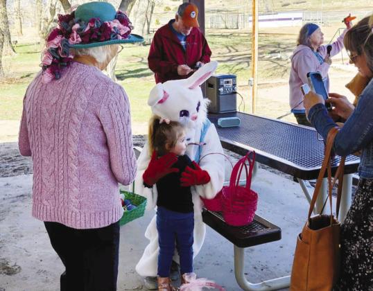 - The Easter Bunny gives a hug to a youngster just before the start of the VFC Easter Egg Hunt. In the background, Judy Patrick holds up one of the special carrots while explaining there are even more prizes to be claimed by those lucky enough to find special hidden objects Photo by Shirley Pigg