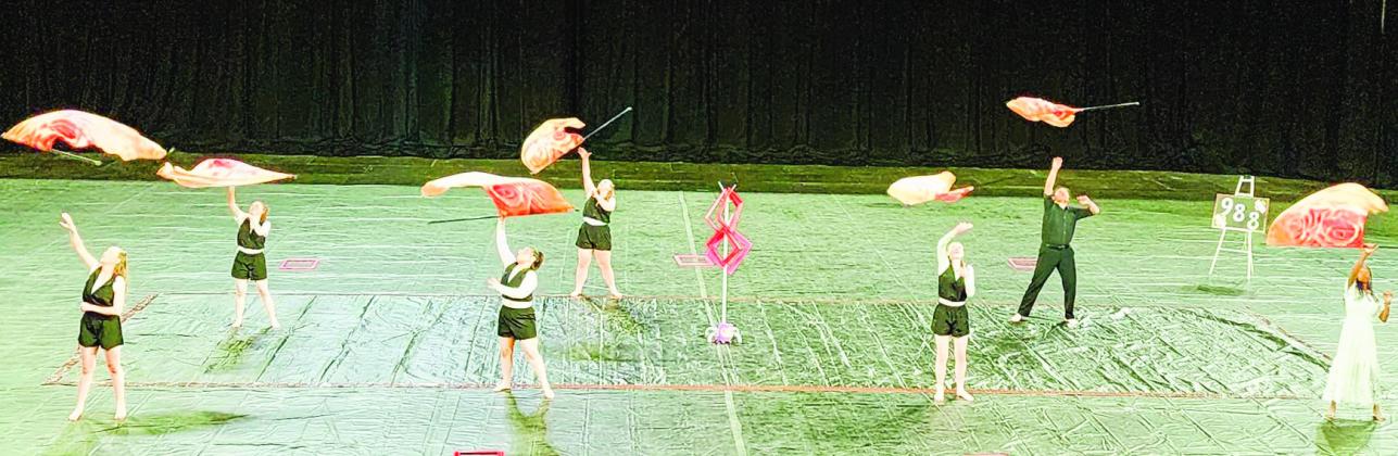The Thunderbolt WinterGuard twirl their flags in their award-winning state championship performance. Courtesy Photo